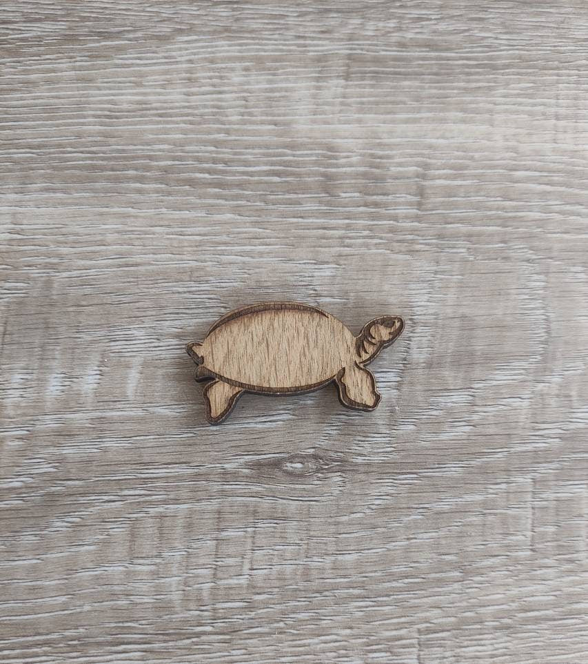 Tortoise-shaped needle minder, perfect for keeping needles secure while crafting.