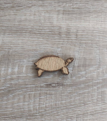 Tortoise-shaped needle minder, perfect for keeping needles secure while crafting.