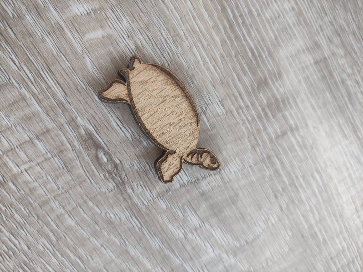 Tortoise-shaped needle minder, perfect for keeping needles secure while crafting.