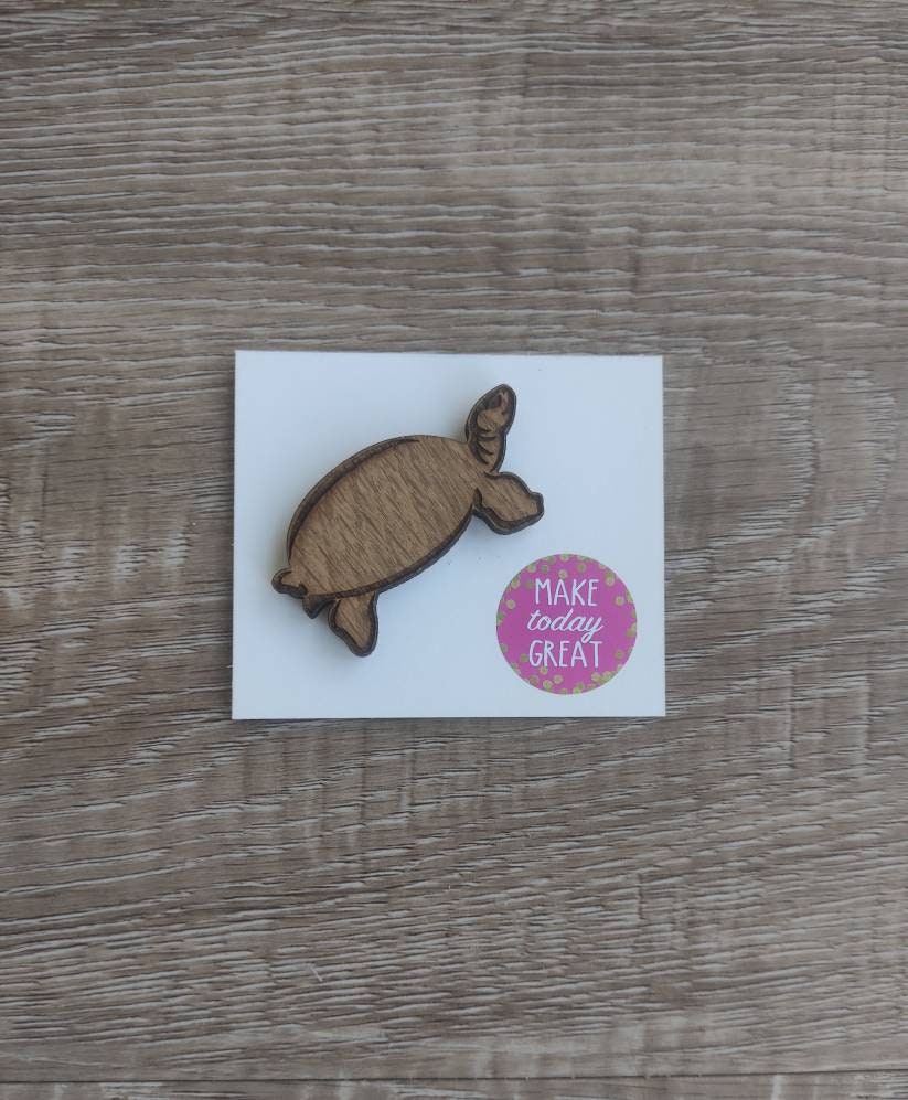 Tortoise-shaped needle minder, perfect for keeping needles secure while crafting.