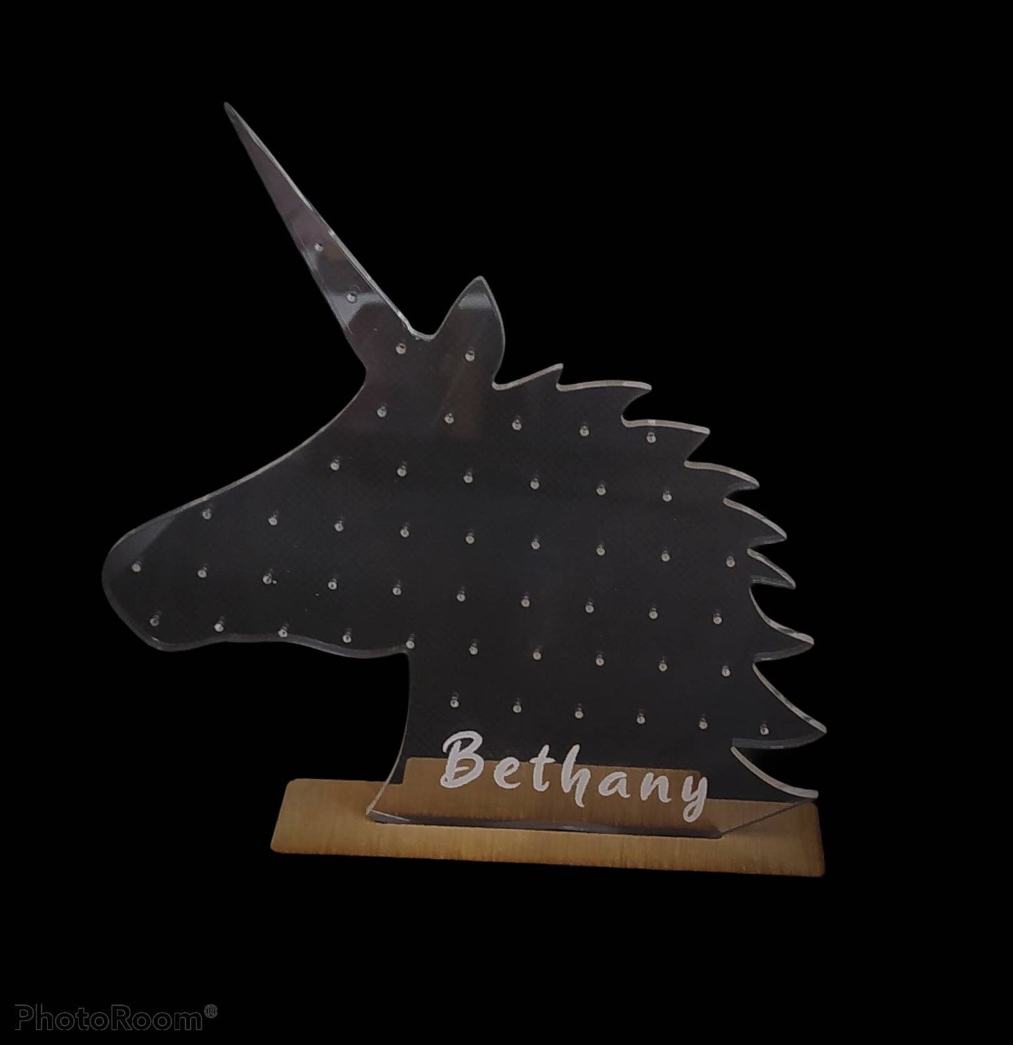 Unicorn Shape Earring Holder which holds 25 studs, engraved with any name at the bottom.