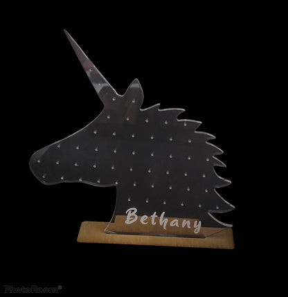 Unicorn Shape Earring Holder which holds 25 studs, engraved with any name at the bottom.