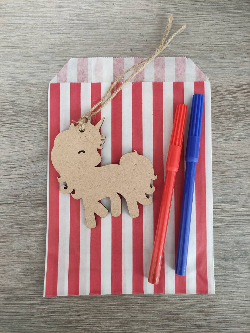 Wooden laser-cut shape with a hole at the top for hanging, string included, and 2 coloured pens inside a paper bag.