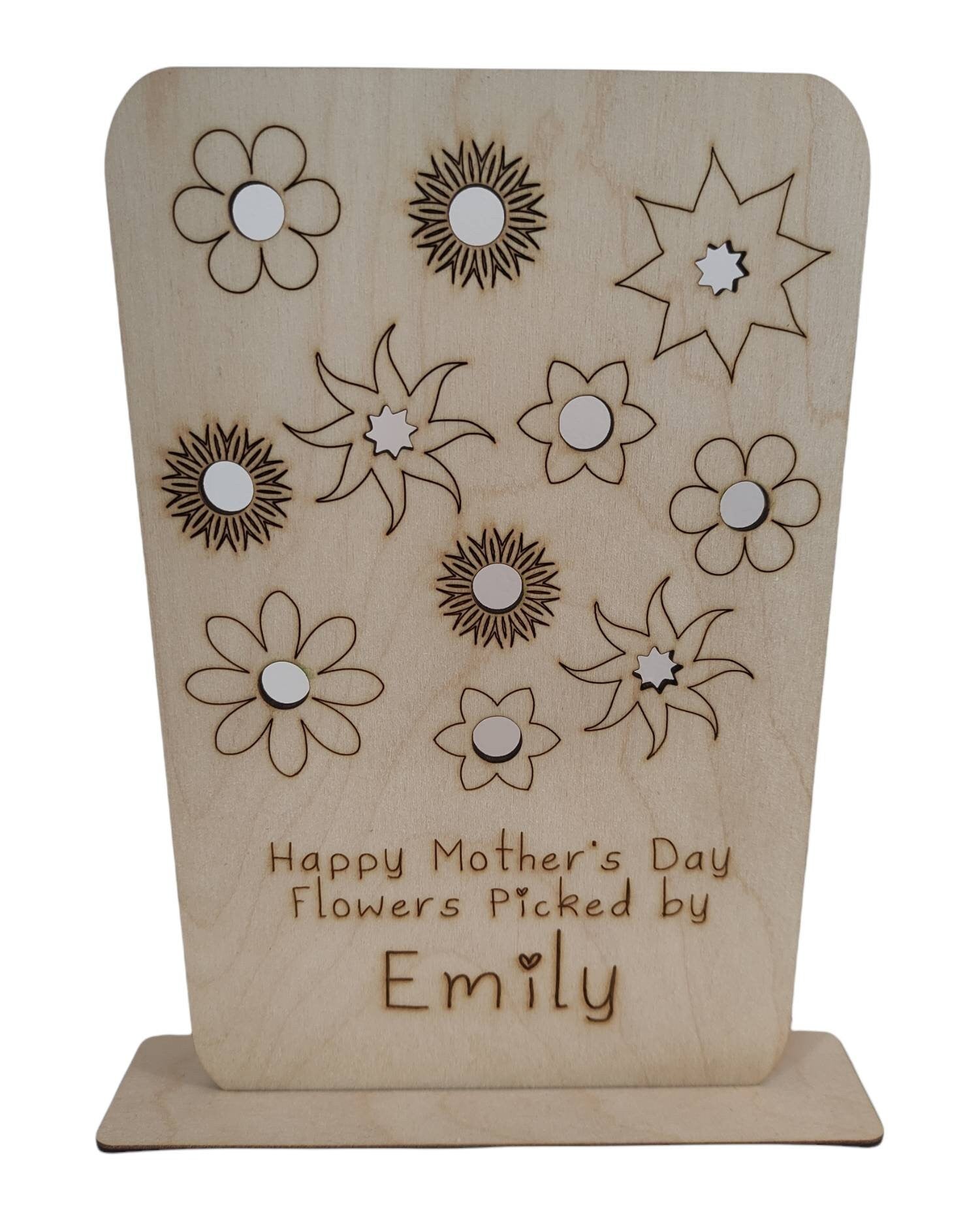 Personalised wooden floral decoration, intricately laser-engraved with flower designs and featuring holes to add your own blooms. 