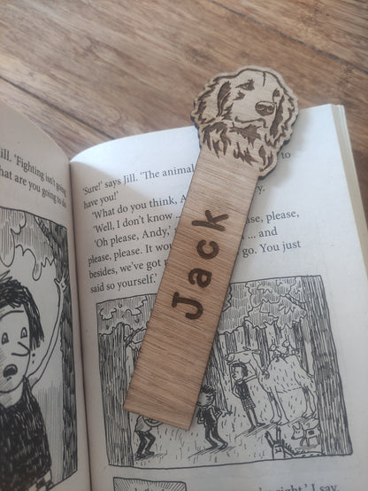 Personalised oak veneer dog bookmark with a dog design at the top and a custom name engraved vertically down the middle. Perfect for children's gifts, stocking stuffers, and party bag fillers.