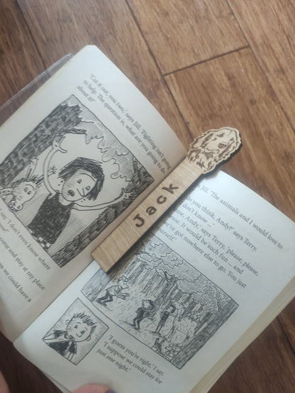 Personalised oak veneer dog bookmark with a dog design at the top and a custom name engraved vertically down the middle. Perfect for children's gifts, stocking stuffers, and party bag fillers.